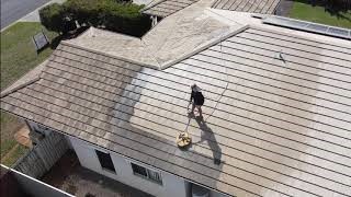 showing roof cleaning